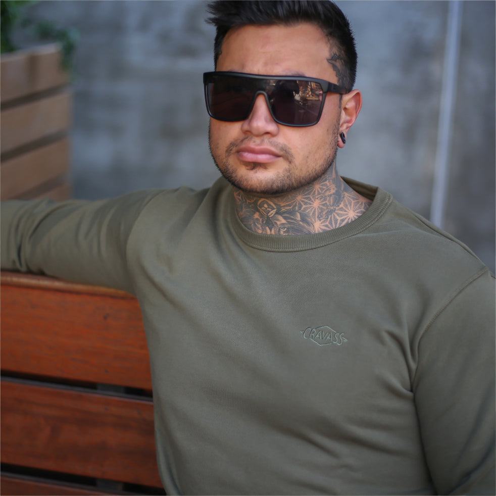 Mens army green jersey with embroidered maori design from streetwear brand Cravass