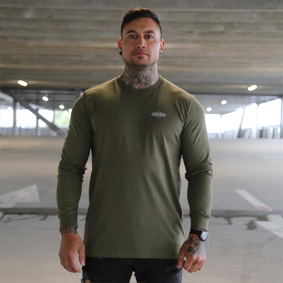 Mens green long sleeve tshirt with the meaning of the maori word mana on the back. Front view