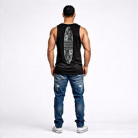 Man wearing a black tank top with Maori design on the back and blue jeans from Cravass.
