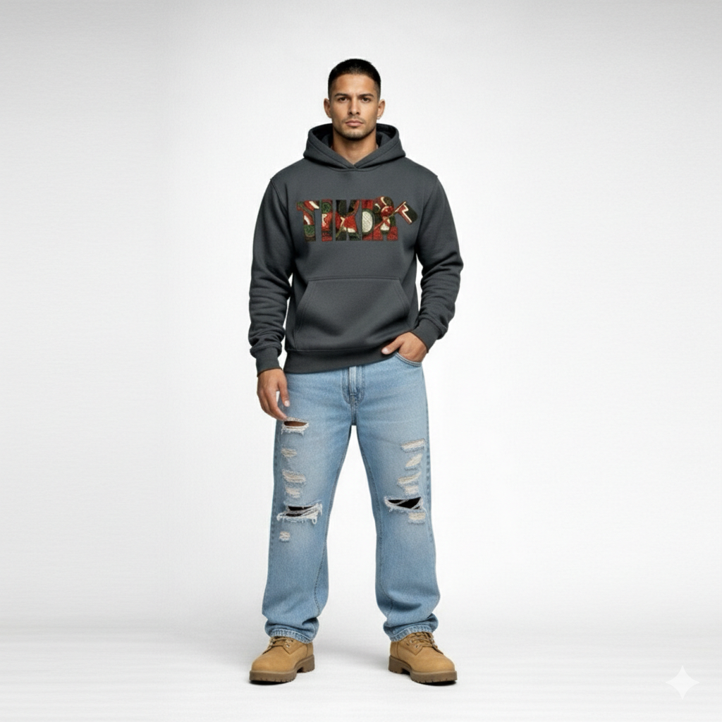 Front-facing male model in Cravass Tiki hoodie featuring Māori-inspired TIKI artwork and textured woven streetwear graphic