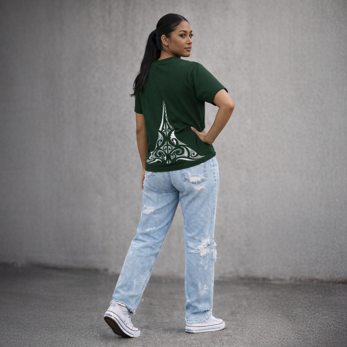 Person wearing a green t-shirt with a design on the back and light blue jeans against a gray background