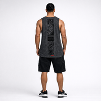 Man wearing a black singlet with Maori back design by Cravass. 