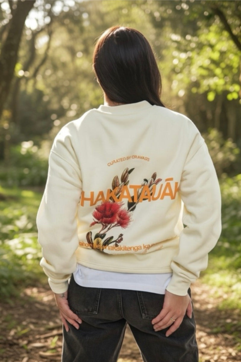 Female Model wearing a cream-colored hoodie with floral design streetwear by Cravass