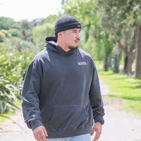 Men's faded black hoodie with Maori art and design from cravass clothing. 