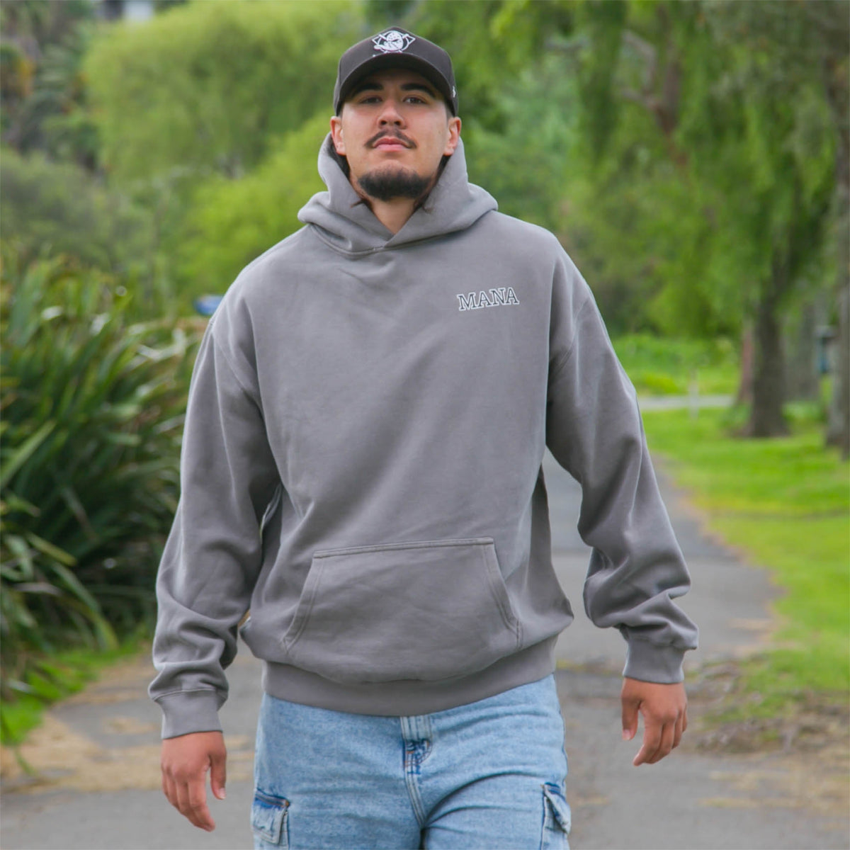 Men's faded grey hoodie with Maori art and design from cravass clothing. 