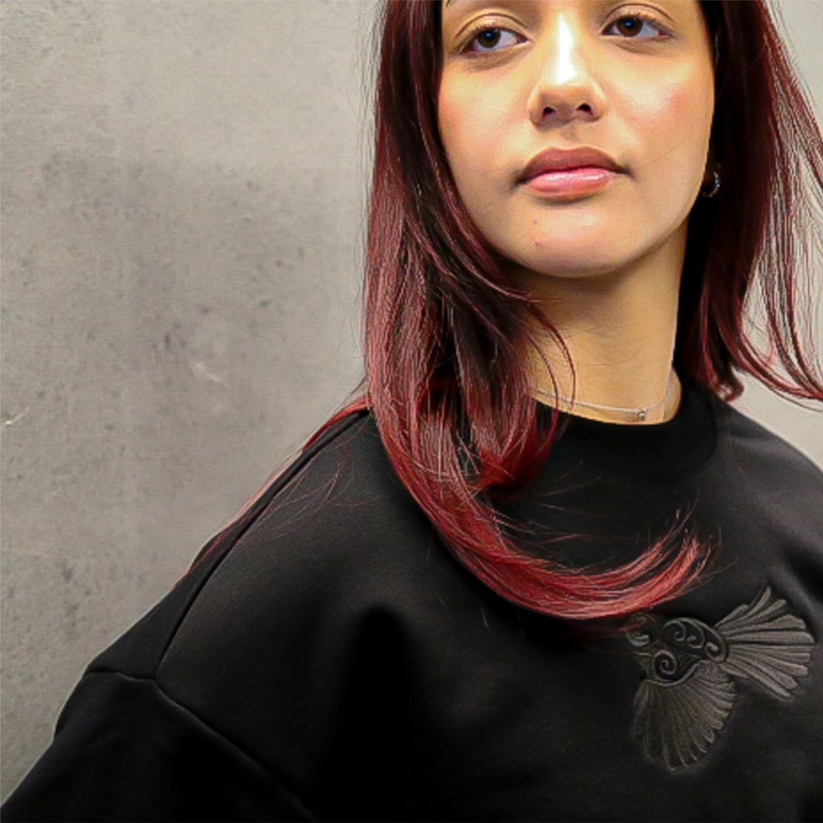 Pīwakawaka Black Women's Crew by Cravass with black-on-black embroidery, relaxed fit and drop shoulder