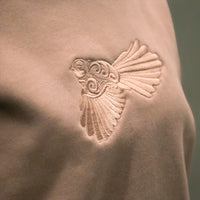 Close-up of tonal Pīwakawaka embroidery on Cravass Hazy Pink Women's Crew