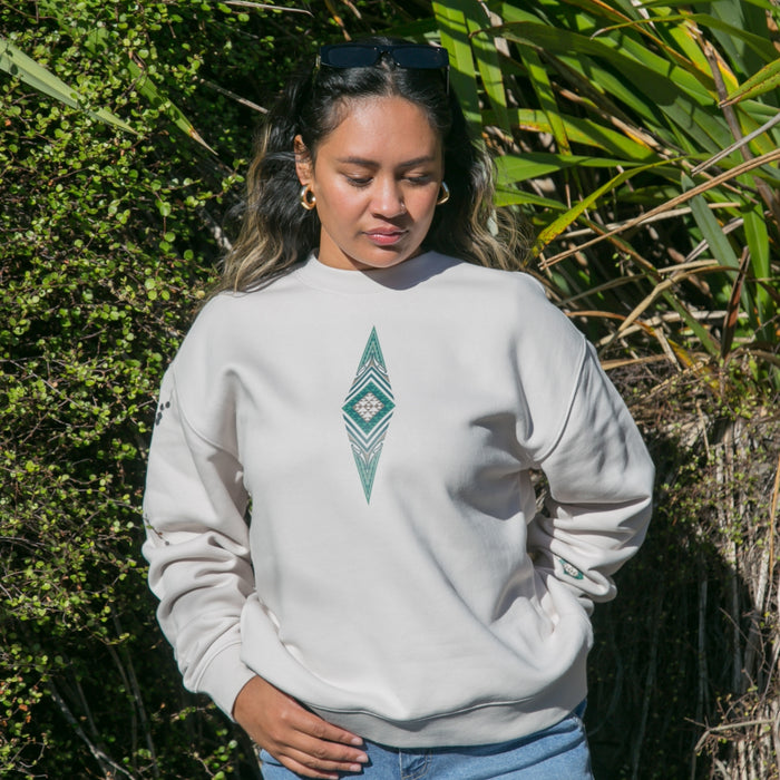 Women's jersey with green contemporary Maori design.