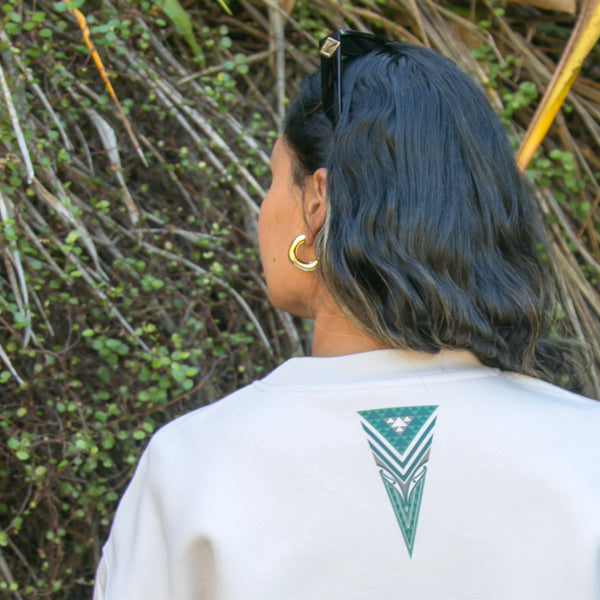 Women's jersey with green contemporary Maori design.