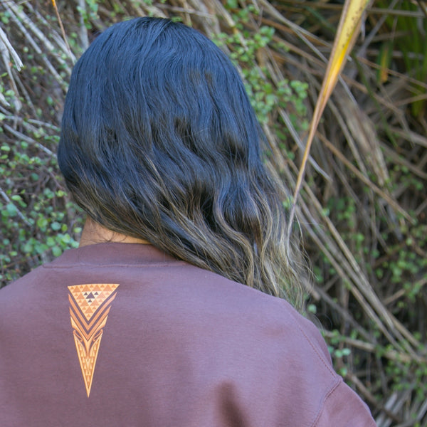 Women's jersey with brown contemporary Maori design.