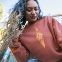 Women's jersey with brown contemporary Maori design.