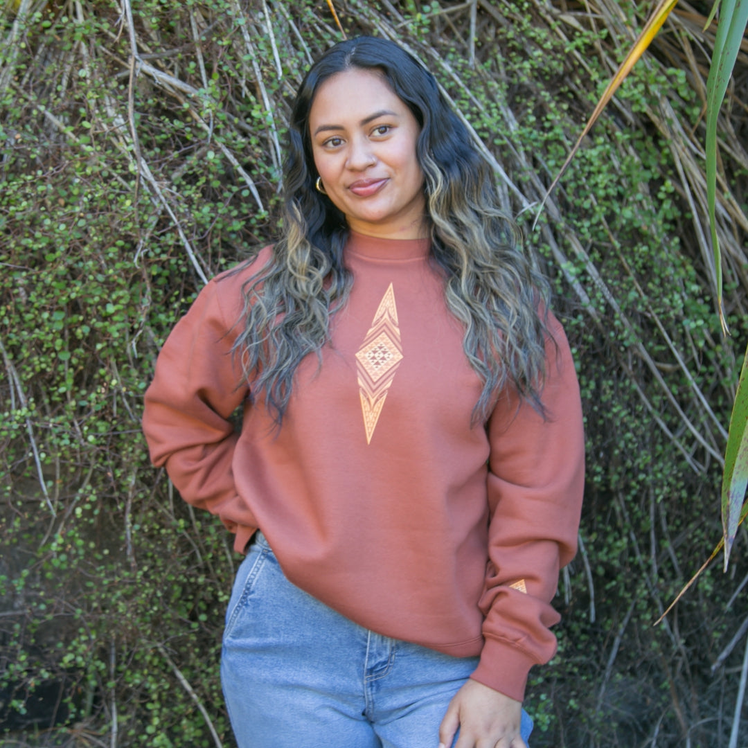 Women's jersey with brown contemporary Maori design.