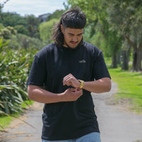 Men's black T-shirt with gold Maori design from Cravass clothing - Front