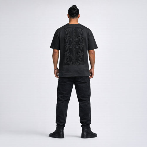 Mens black t-shirt with original Maori design on the back, standing against a white background