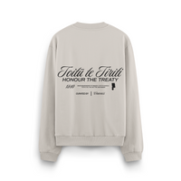 Close-up of Toitū te Tiriti Māori typography on heavyweight crewneck