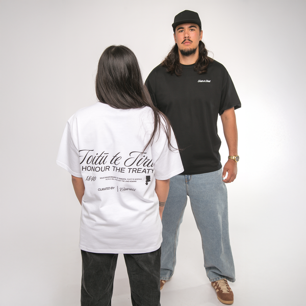 Two people wearing cravass t-shirts on a plain background