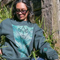 Pine green women's crew jersey with green contemporary Maori design. Maori fashion