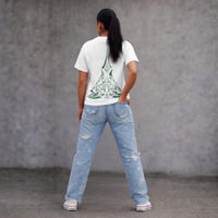 Lower Back Wha Māori ta moko women’s white t-shirt with green maori design NZ streetwear by Cravass