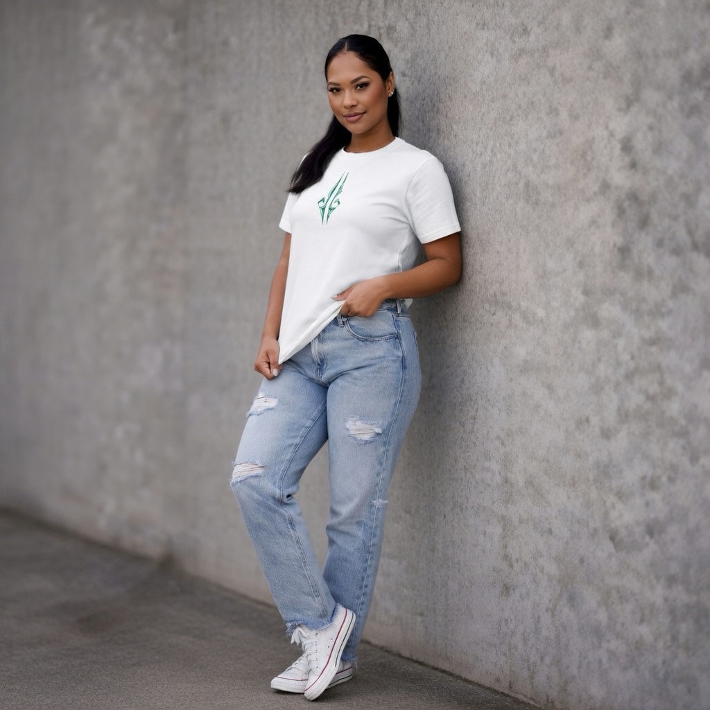 Model leaning agaist wall wearing Women’s white t-shirt with green Maori ta moko design NZ streetwear by Cravass
