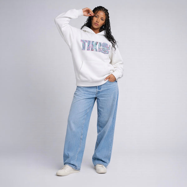 Female model wearing Cravass Maori inspired streetwear hoodie Tiki collection