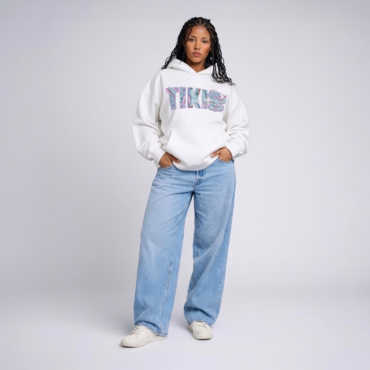 Model wearing Cravass Pihi Makaurangi hoodie from the Tiki streetwear collection