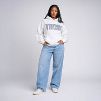 Model wearing Cravass Pihi Makaurangi hoodie from the Tiki streetwear collection