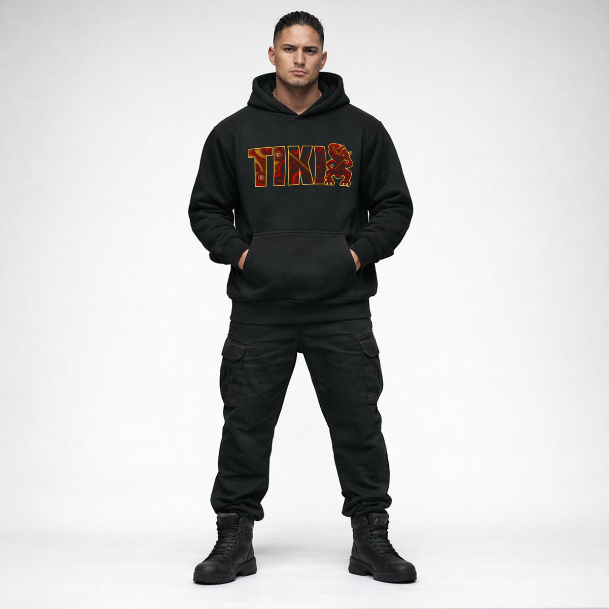 Black Cravass AHI Tiki hoodie worn by male model featuring bold red Māori-inspired TIKI graphic, New Zealand streetwear design