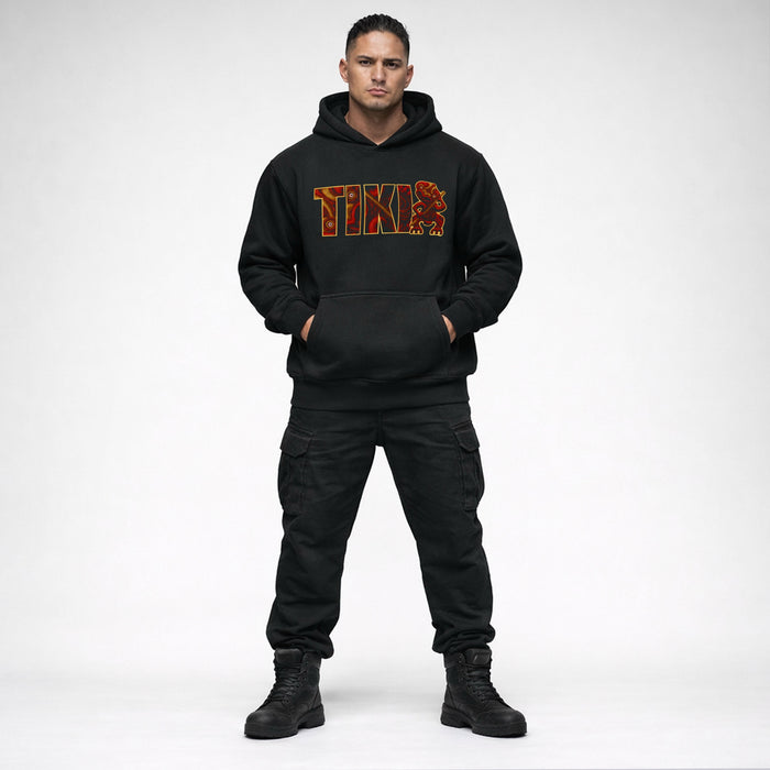 Black Cravass AHI Tiki hoodie worn by male model featuring bold red Māori-inspired TIKI graphic, New Zealand streetwear design
