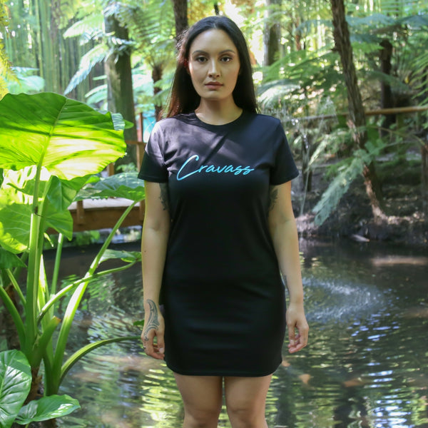 Women's black dress with stunning satin blue Maori design. Front view with cravass logo.