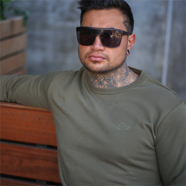 Mens army green jersey with embroidered maori design from streetwear brand Cravass