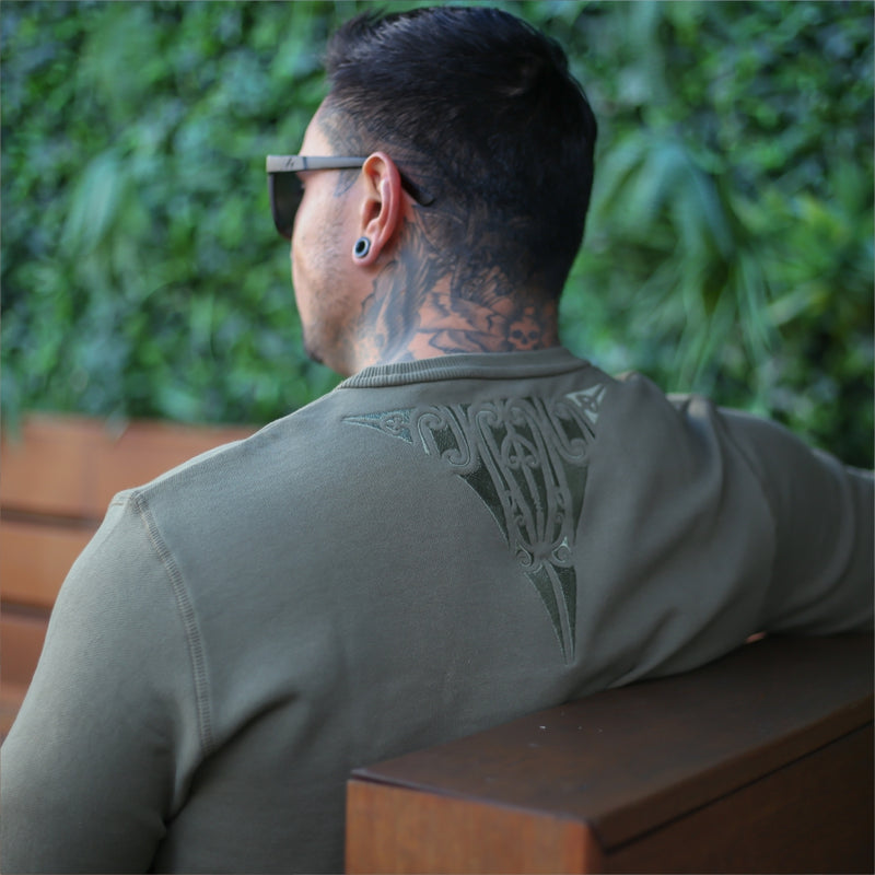 Mens army green jersey with embroidered maori design.