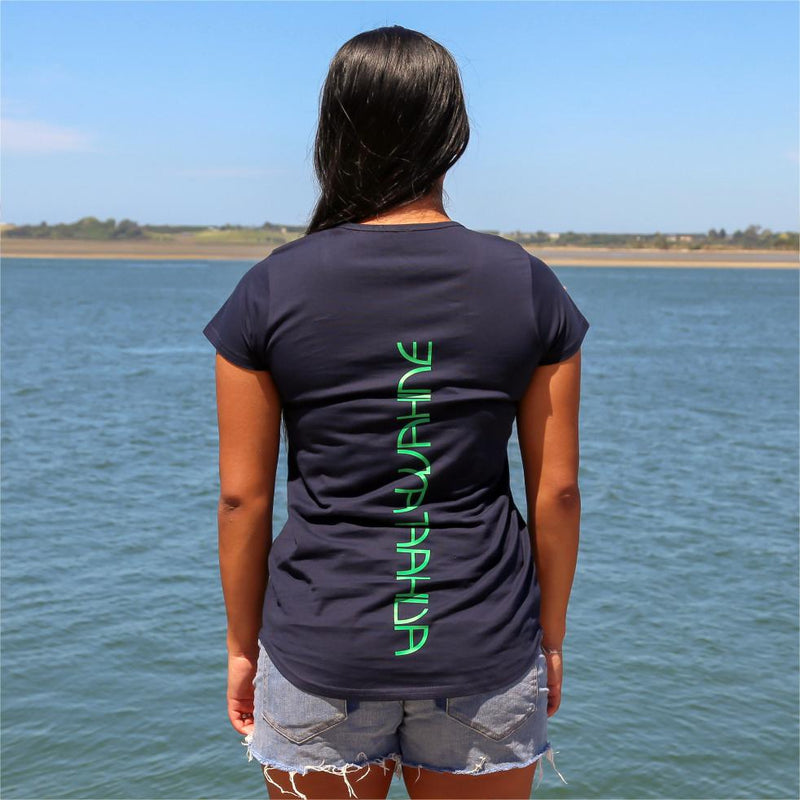 Women's navy tshirt with green maori design stripe. Back view with the words Ataahua Wahine.
