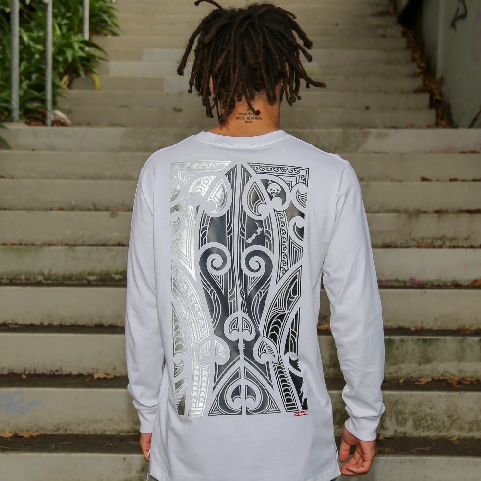 White longsleeve t-shirt with silver, grey and black Maori design.