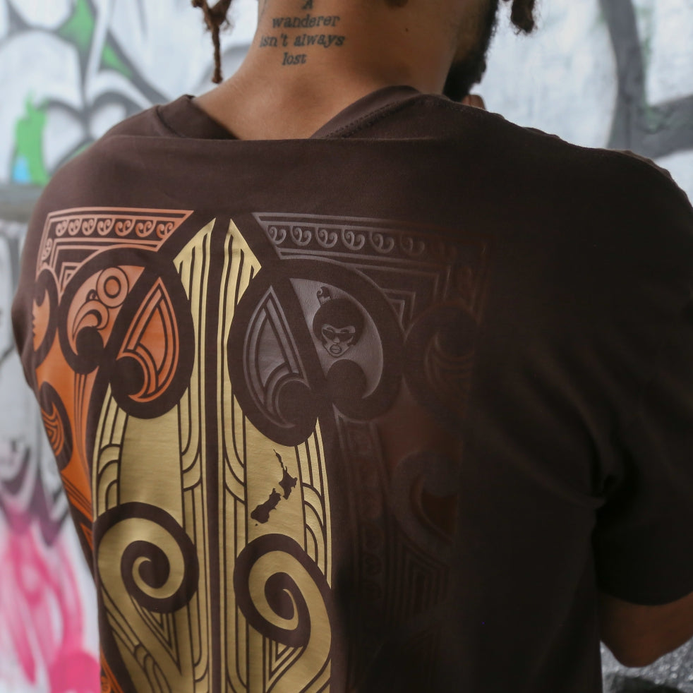Men's brown t-shirt with copper, brown and brown Maori art and design on the back.