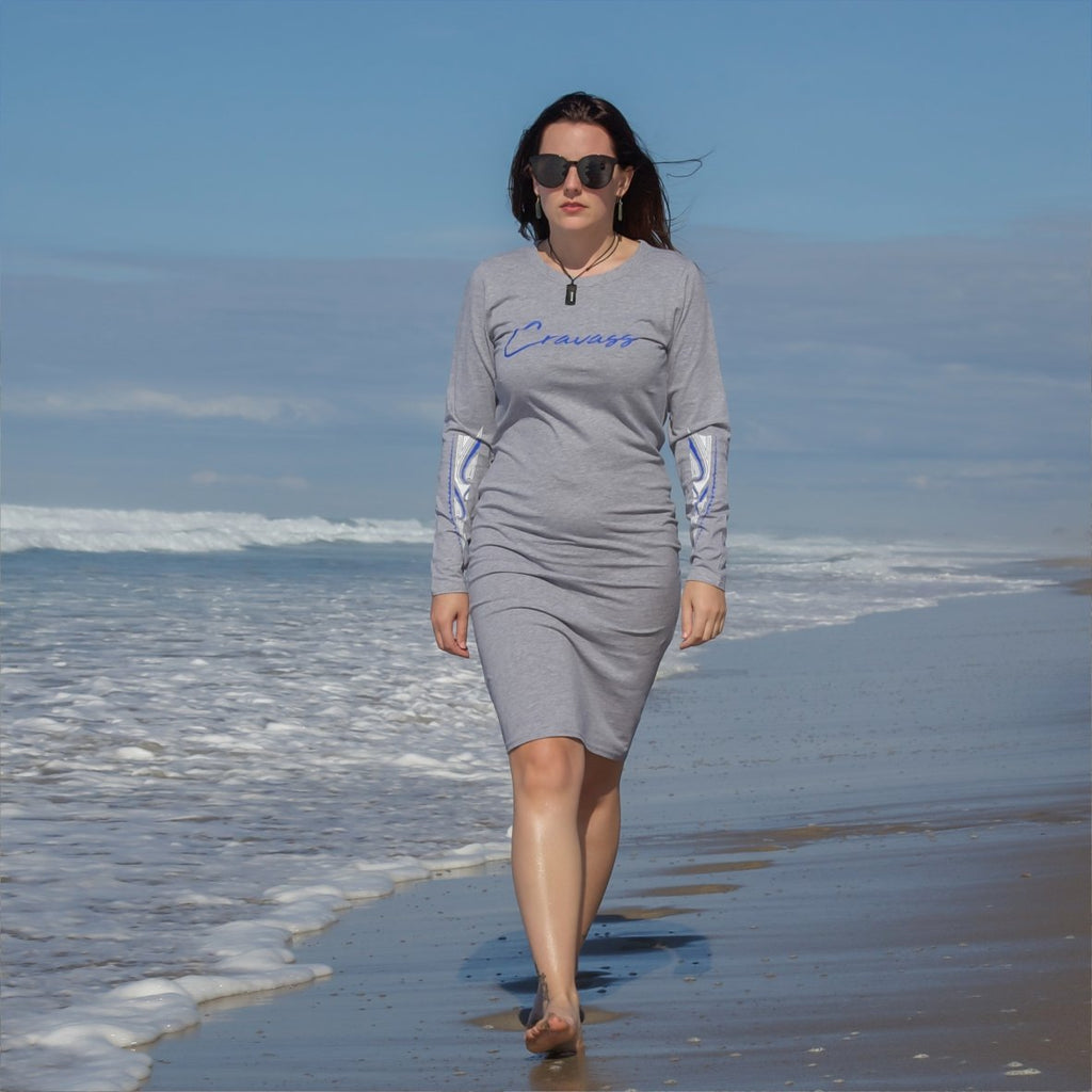 Model walking along papamoa beach wear grey dress with ta moo designs