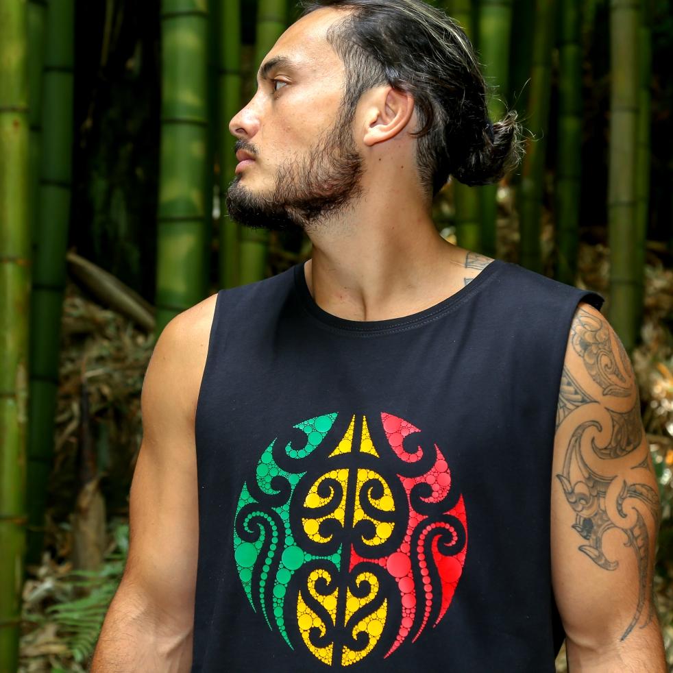 Model wearing black singlet with Rasta coloured Maori design from New Zealand clothing brand Cravass