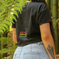 Women's black crop top with Rasta coloured Maori design from Cravass Clothing. Back
