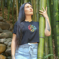 Women's black crop top with Rasta coloured Maori design from Cravass Clothing.