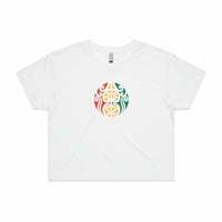 Women's white crop top with Maori design in Rasta colours