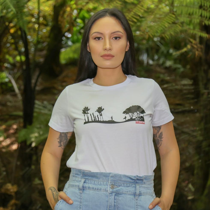 Women's white t shirt with black surfing scene, surfers, nikau palm, pohutakawa. 