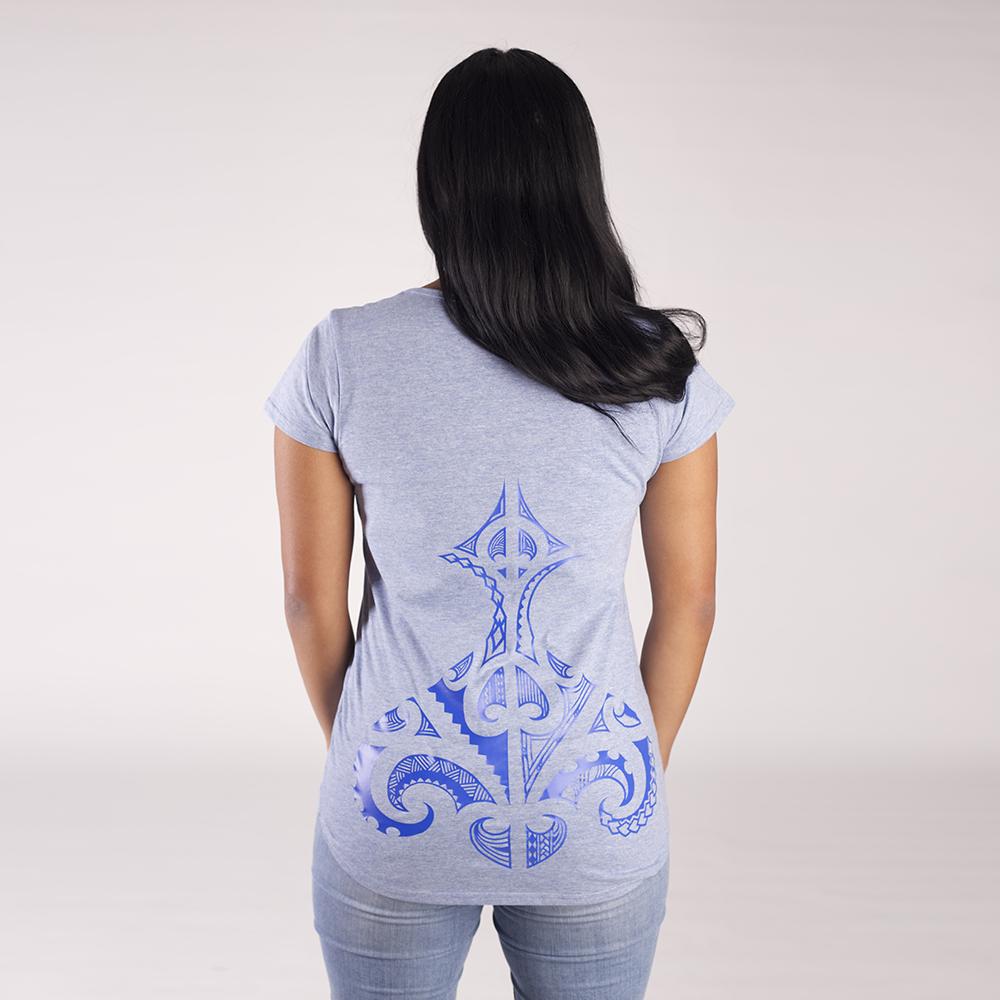 Back view of blue women's tshirt with original maori ta moko design on the lower back.