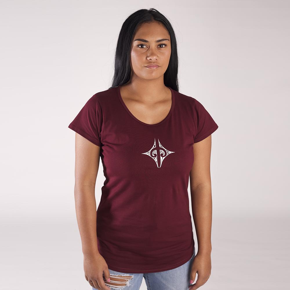 Model wearing beautiful burgundy womens tshirt with a small maori design on the front chest. 
