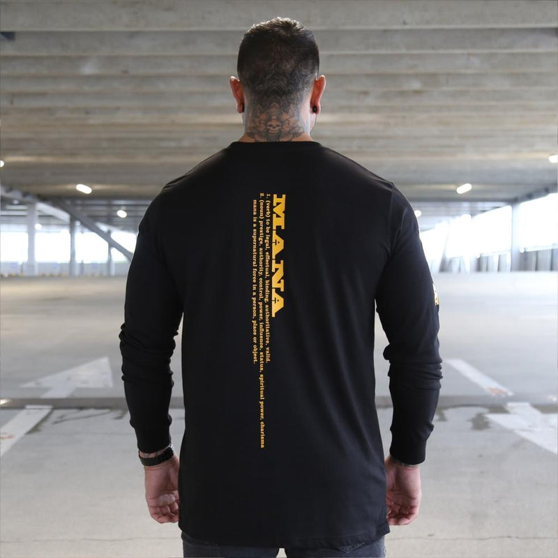 Mens black long sleeve tshirt with yellow Maori design. Meaning of Mana. Back view.