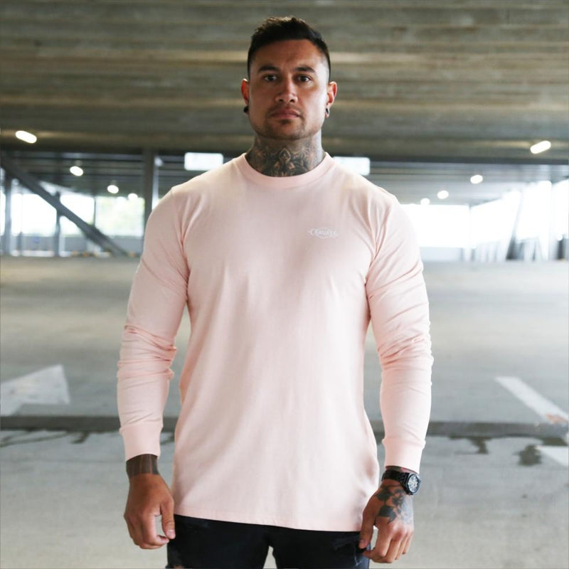 Mens pink long sleeve tshirt with white Maori design. Meaning of Mana. Front view.