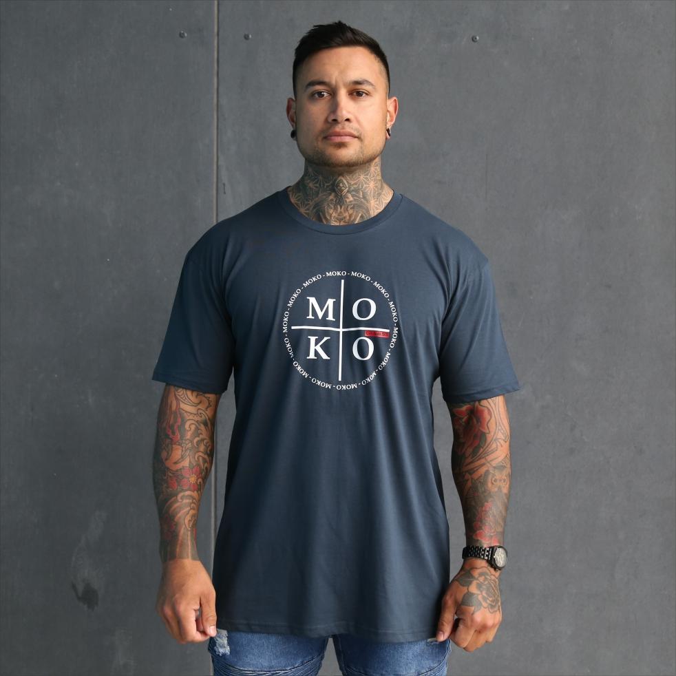 Mens blue tshirt with white maori wording design. Moko - maori artform or tattoo. Front view