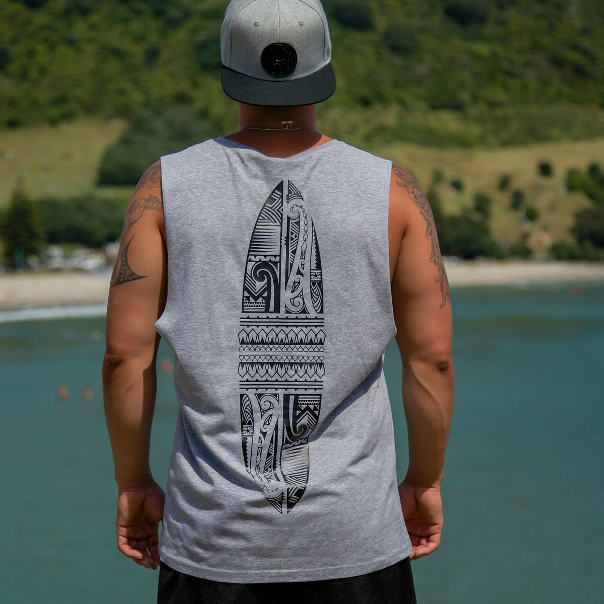 Cravass grey tank top with black Polynesian Maori design down the back 