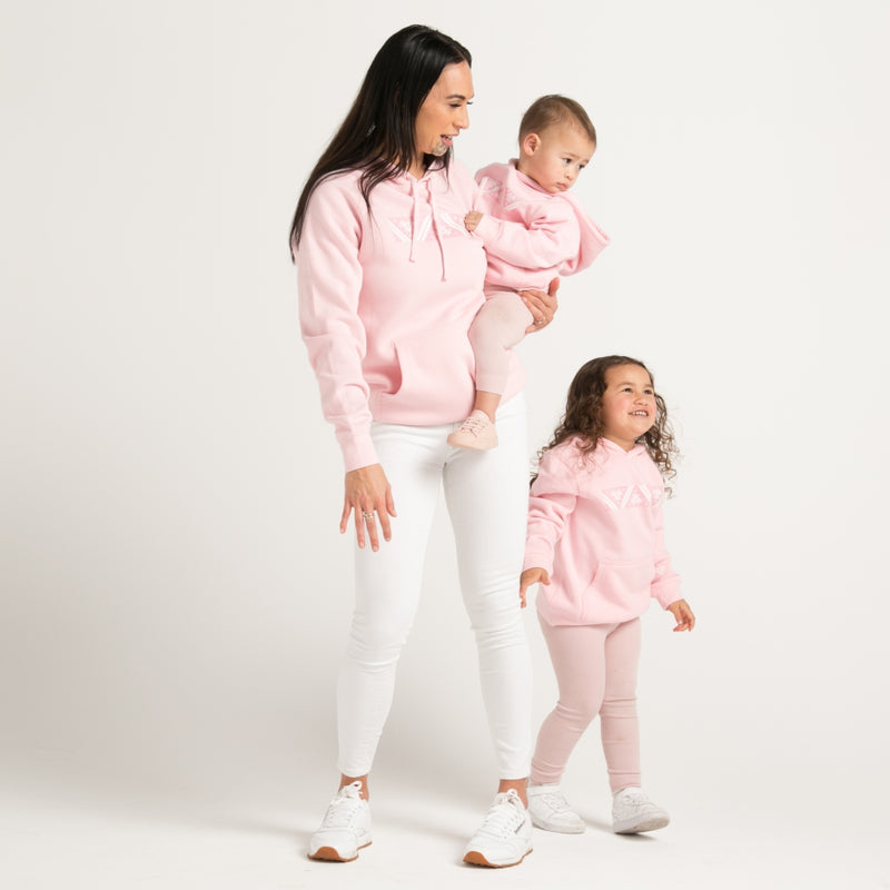 Pink kids hoodie with pink and white Maoro Taniko design from Cravass Clothing New Zealand.