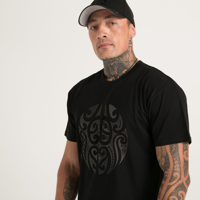 Black on black men's t-shirt from Cravass clothing. Original Maori ta moko design.