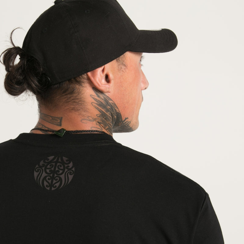 Black on black men's t-shirt from Cravass clothing. Original Maori ta moko design.