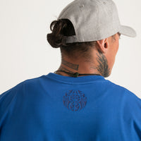 Blue on blue men's t-shirt from Cravass clothing. Original Maori ta moko design.